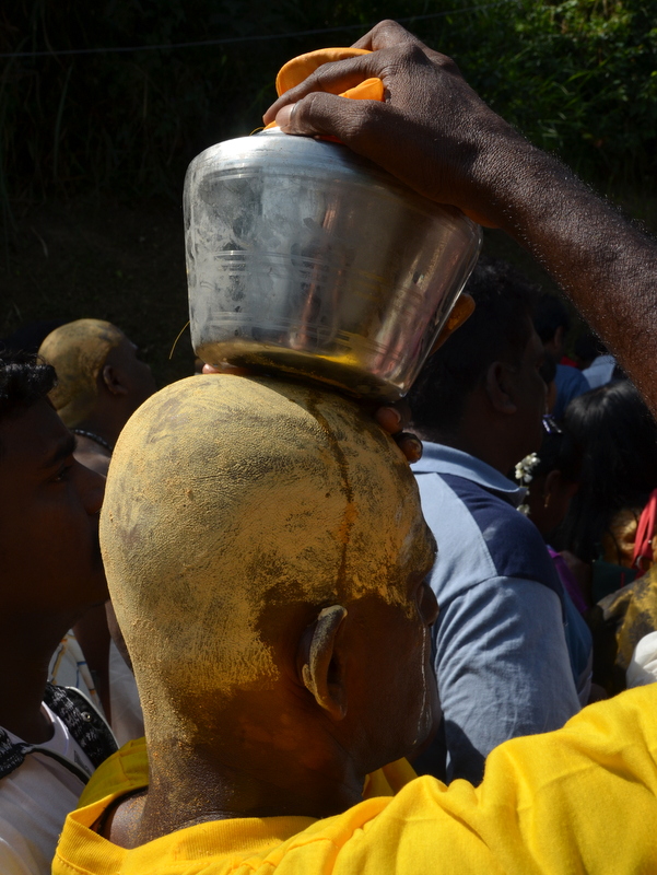 Carrying a pot with milk